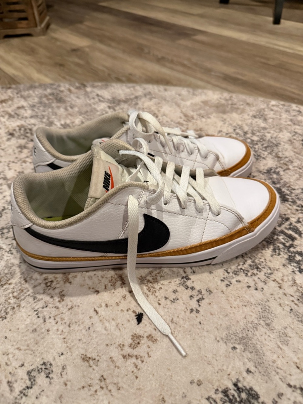 Nike White Sneakers with Black Swoosh and Tan Accent